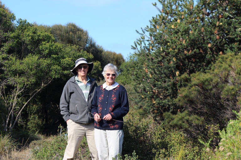 Ian and Roma Edwards stand in their Indigenous garden.